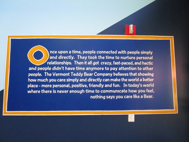 Vermont Teddy Bear use a bear to show love sign