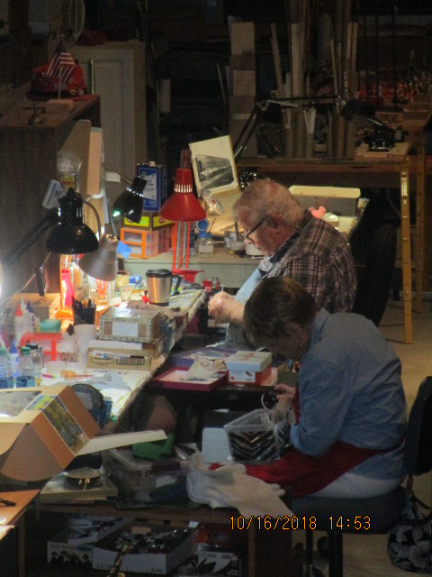 voluteers working on howard circus figures